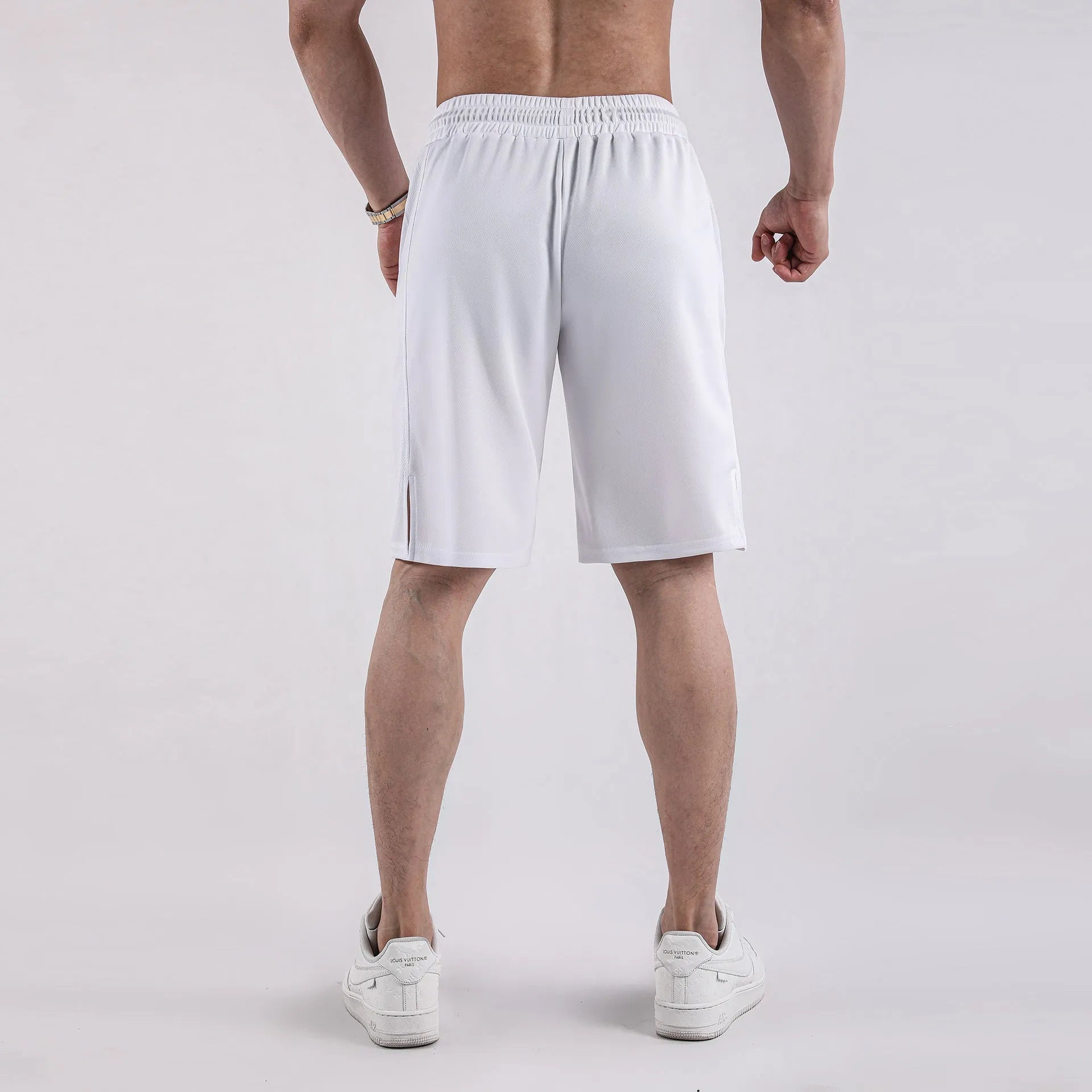 Men's black quick-drying mesh shorts with a loose fit and elastic waistband for summer sports.