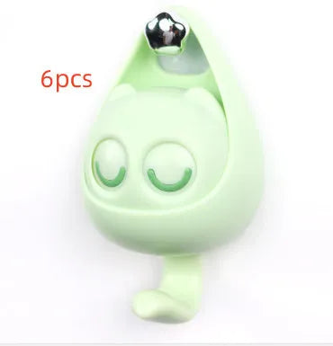 Cream white cat-shaped adhesive wall hook with winking eyes, 2.5kg capacity, 105x61x45mm