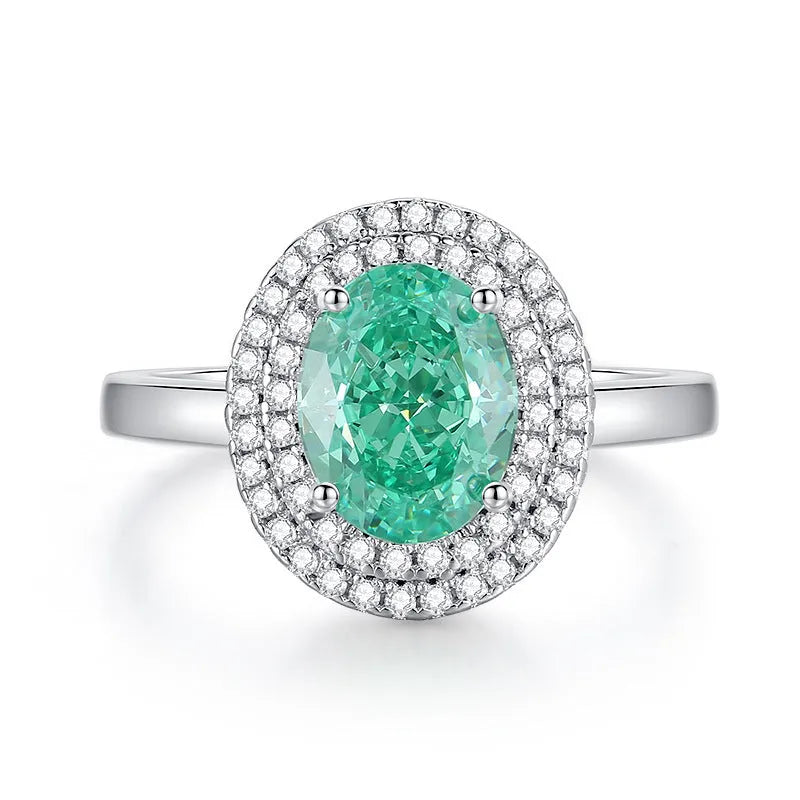 S925 sterling silver women's ring with ellipse emerald and inlaid high carbon diamond in geometric setting.