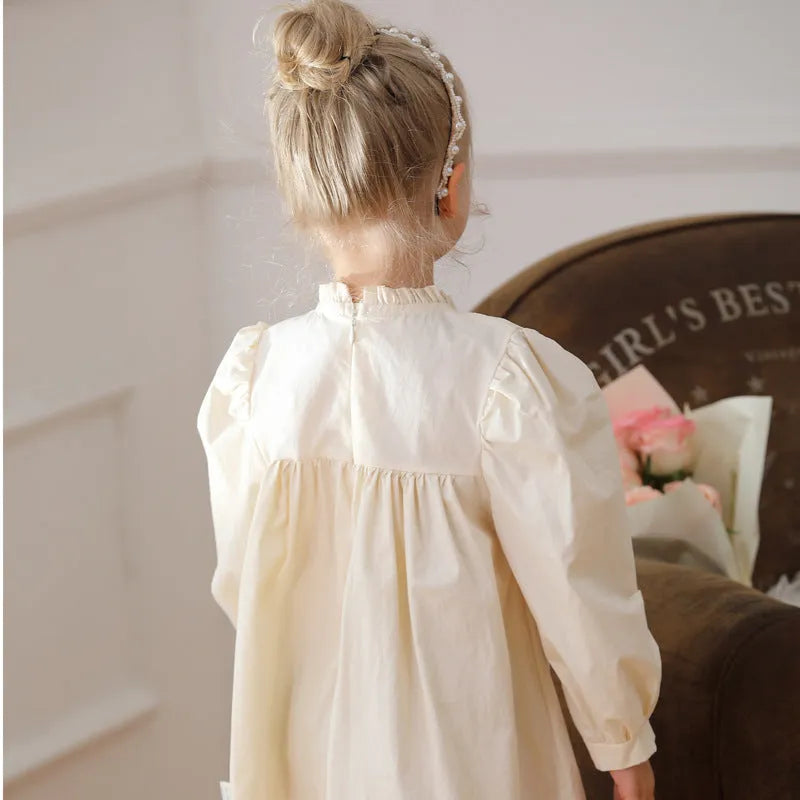Girls apricot dress with flower embroidery, puff sleeves, and cotton lining, available in heights 90cm to 140cm