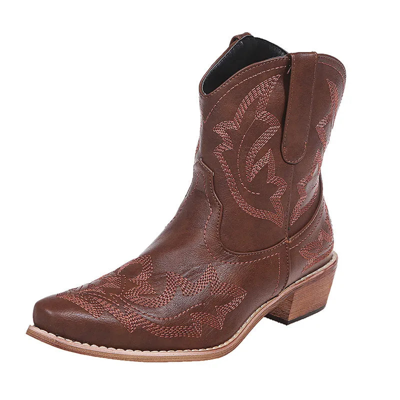 Women's blue embroidered Western ankle boots with a low wedge heel and pointed toe