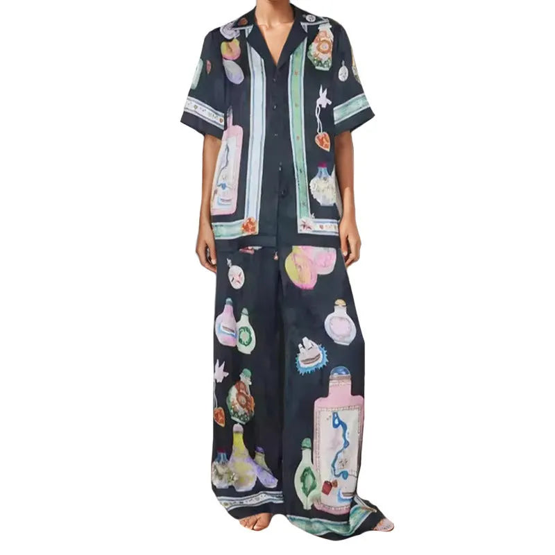 Black women's casual set with cartoon print, featuring a cardigan and trousers.