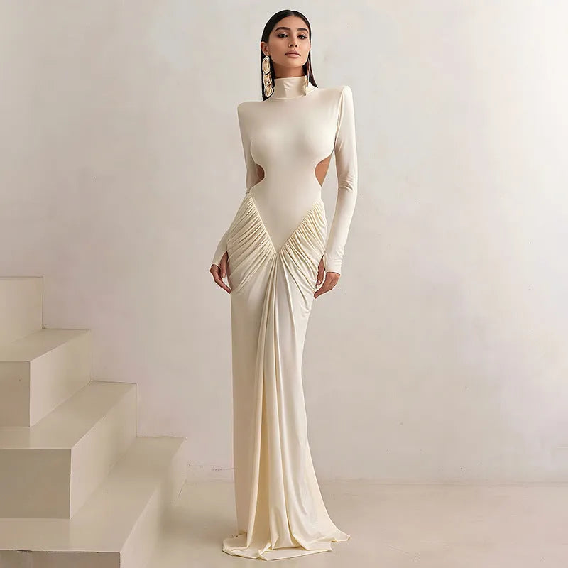 Long sleeve high collar slim fit backless pleated dress in solid colour on a model
