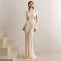 Long sleeve high collar slim fit backless pleated dress in solid colour on a model