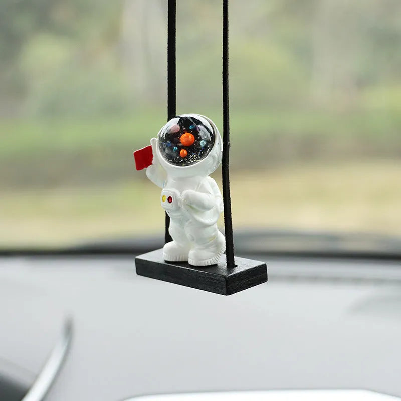 Resin cartoon astronaut car pendant in five designs: telescope, red flag, radish, headrest, and resting astronaut