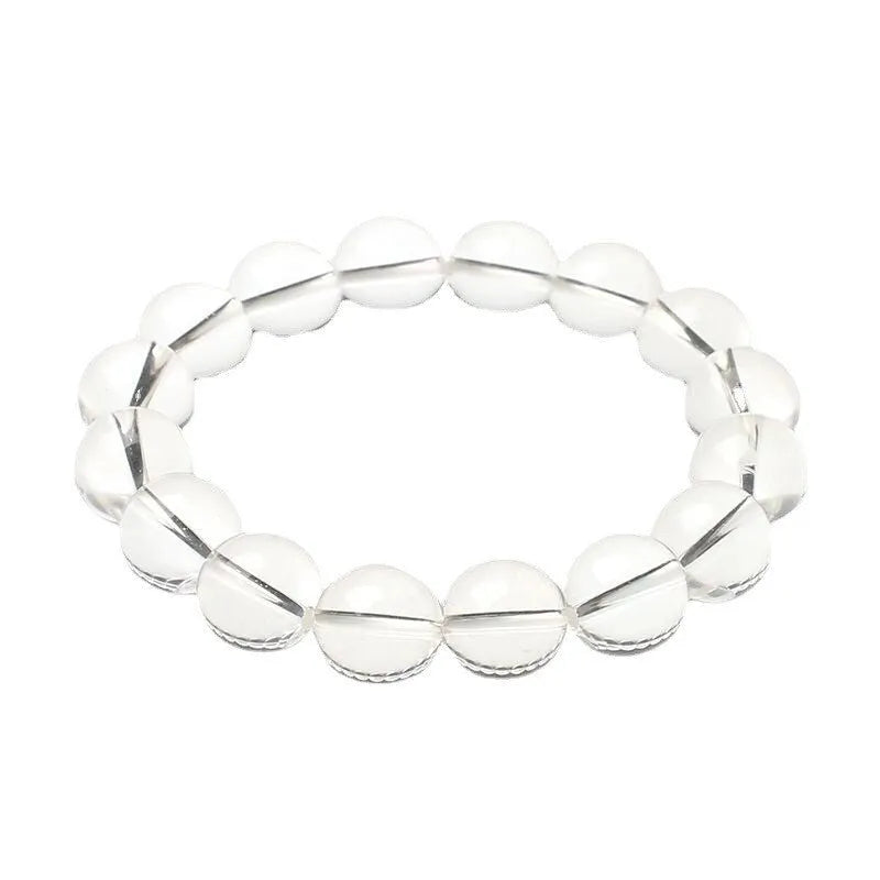 Natural old mine white crystal round bead bracelet with geometric style on a wrist.