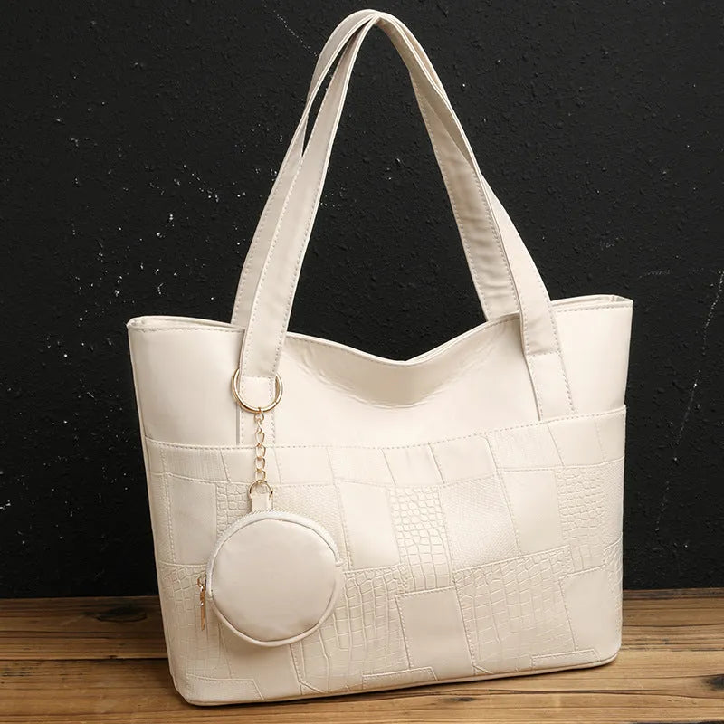 Large capacity soft PU tote bag for women in beige, brown, and black, with double shoulder straps and sewing thread detail.