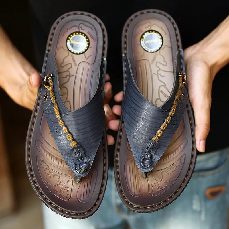 Men's dark blue herringbone patterned outdoor slippers with leather lining and rubber sole, shown in a large size.