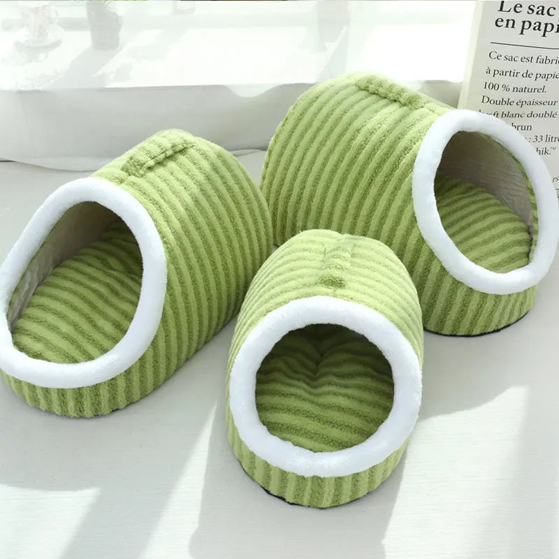 Macaron-shaped cat bed in blue colour, showing three-dimensional design with cloth material
