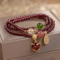 Purplish red garnet crystal fox bracelet with adjustable rope fastening for women