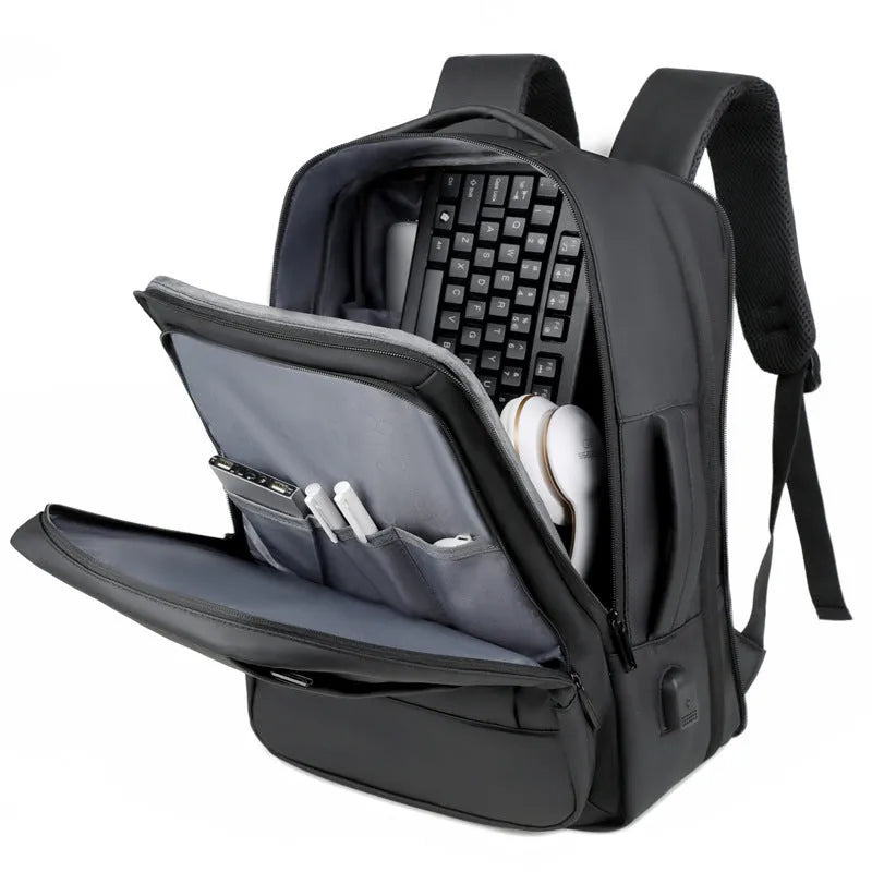 Black Oxford cloth backpack with curved shoulder straps showing business travel styling