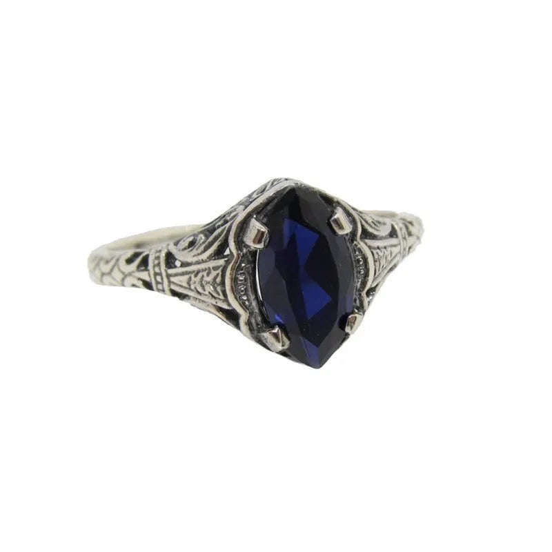 Silver women's geometric hollow alloy ring showing detailed openwork design.