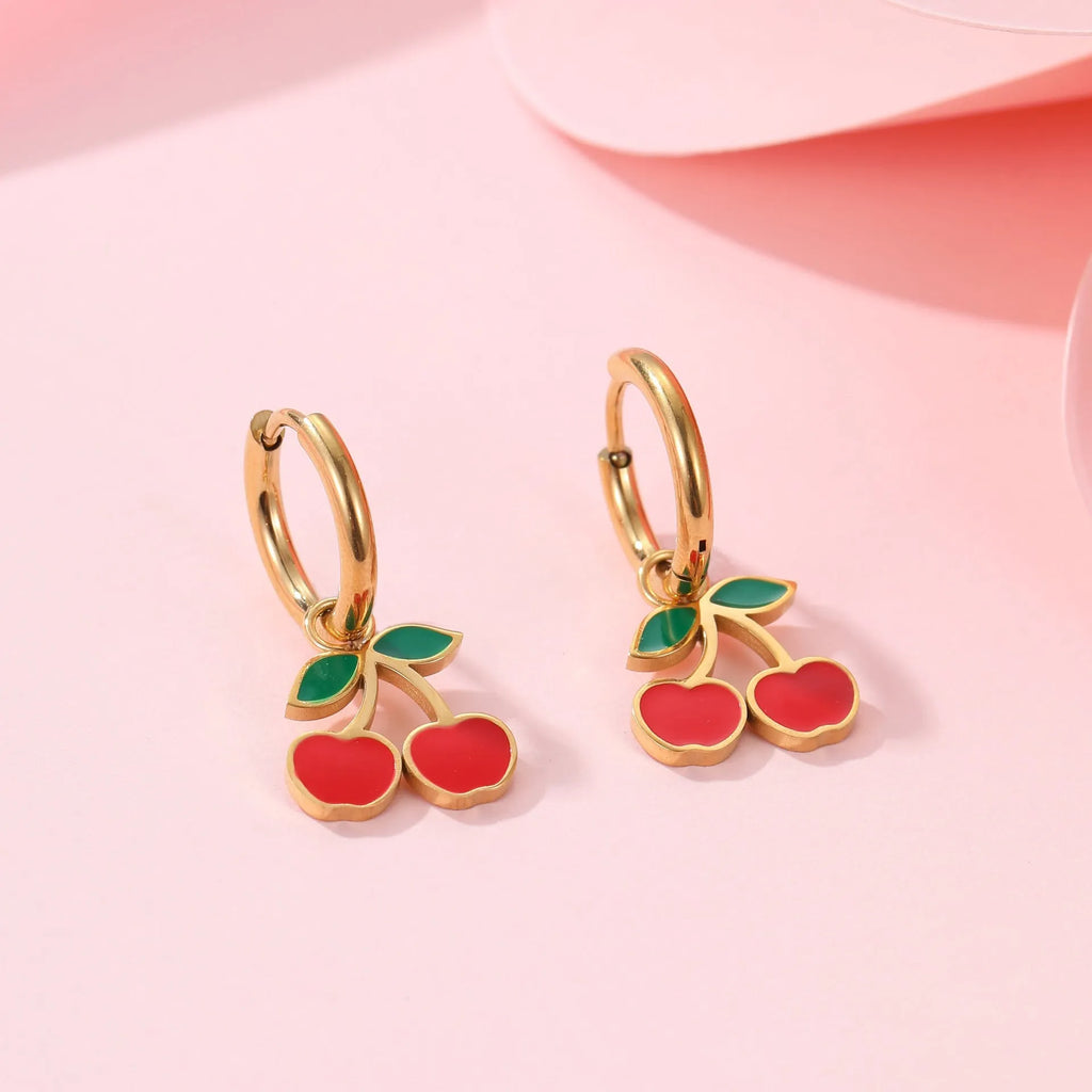 Cherry jewellery set showing necklace, bracelet, earrings, and ring with stainless steel construction