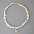 Silver necklace with round medal and irregular pearl geometric pendant on adjustable chain