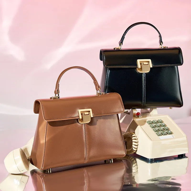 Dark brown women's genuine leather shoulder bag with a metal Vachette clasp, shown open to reveal an interior zippered pocket.
