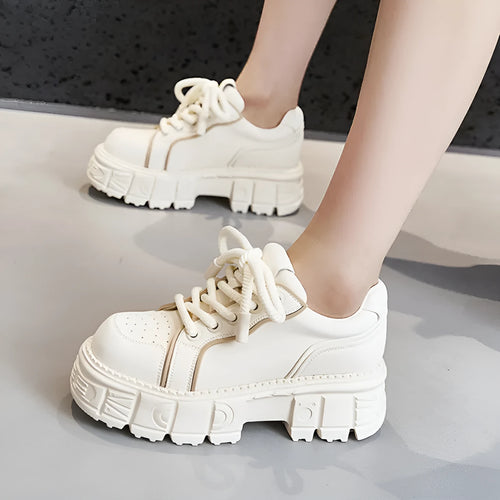 Women's beige and pink casual leather shoes with a rubber foam sole on a white background