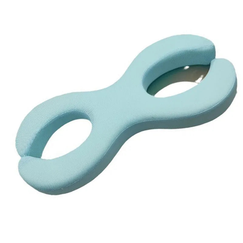 Cool blue cylindrical memory foam cervical pillow for neck pain relief and sleep support.