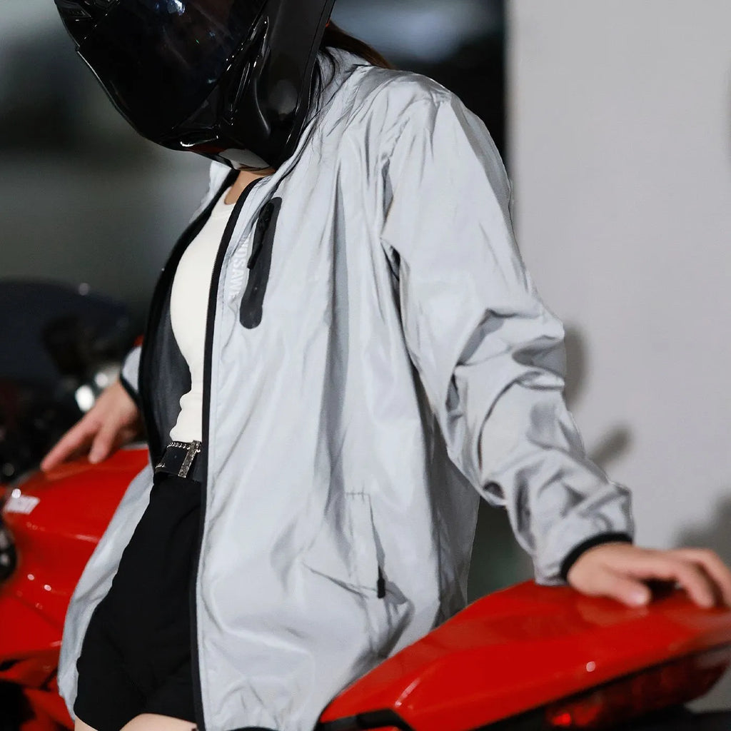 Silver waterproof polyester windbreaker jacket with long sleeves shown on a hanger.