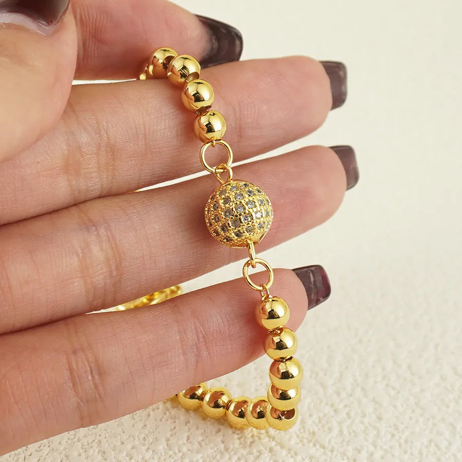 Women's Arabic-style copper bracelet with a heart shape and single zircon ball accent.