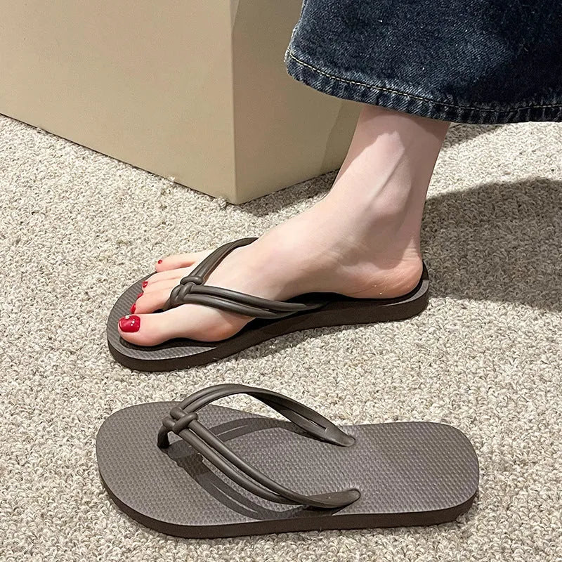 Men's PVC toe-covering flip flops in beige colour on a plain background.