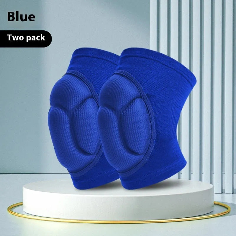 Pair of black thick sponge kneepads for dance and volleyball on a plain background