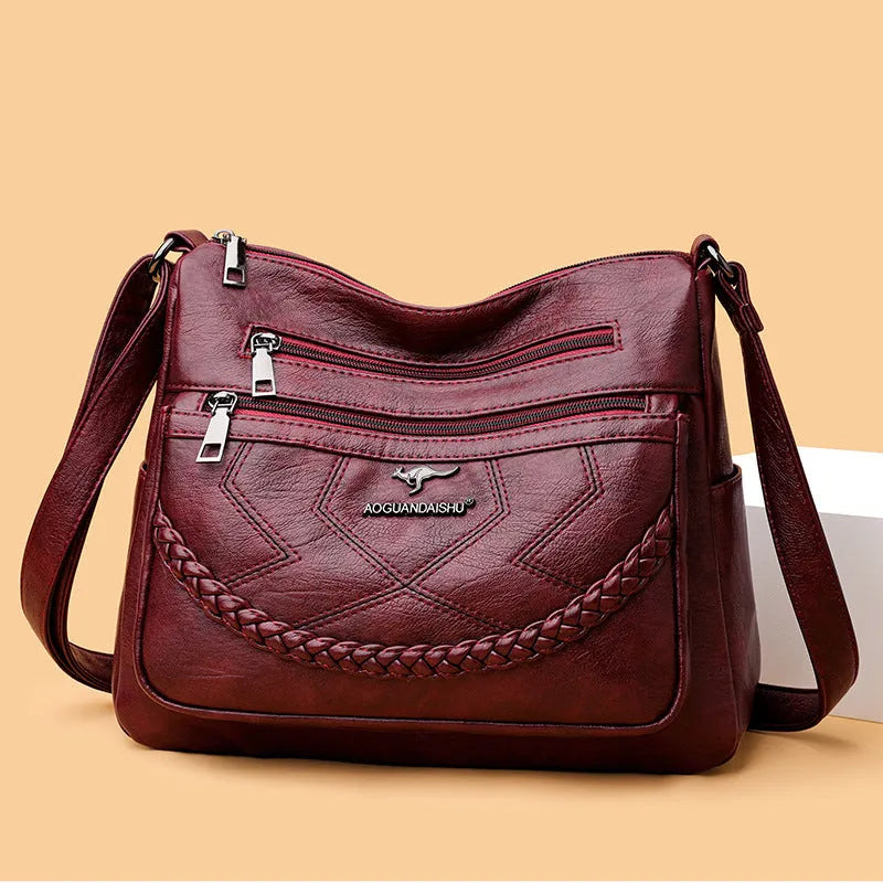 Soft black PU leather women's crossbody shoulder bag with a square shape on a white background.