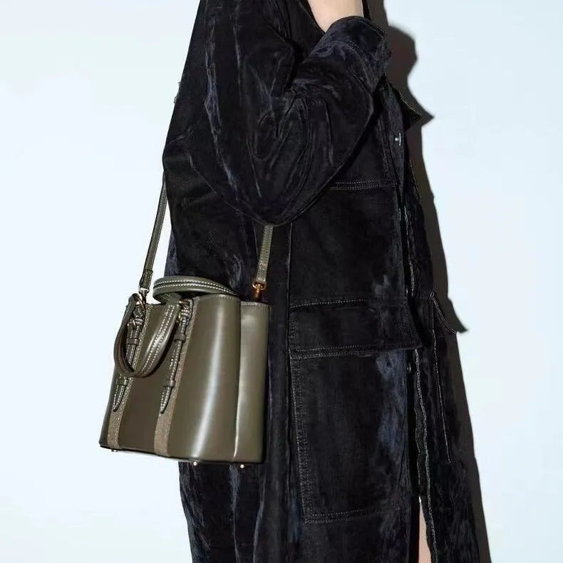 Women's olive green mini city messenger bag in PU leather with single shoulder strap and horizontal square shape