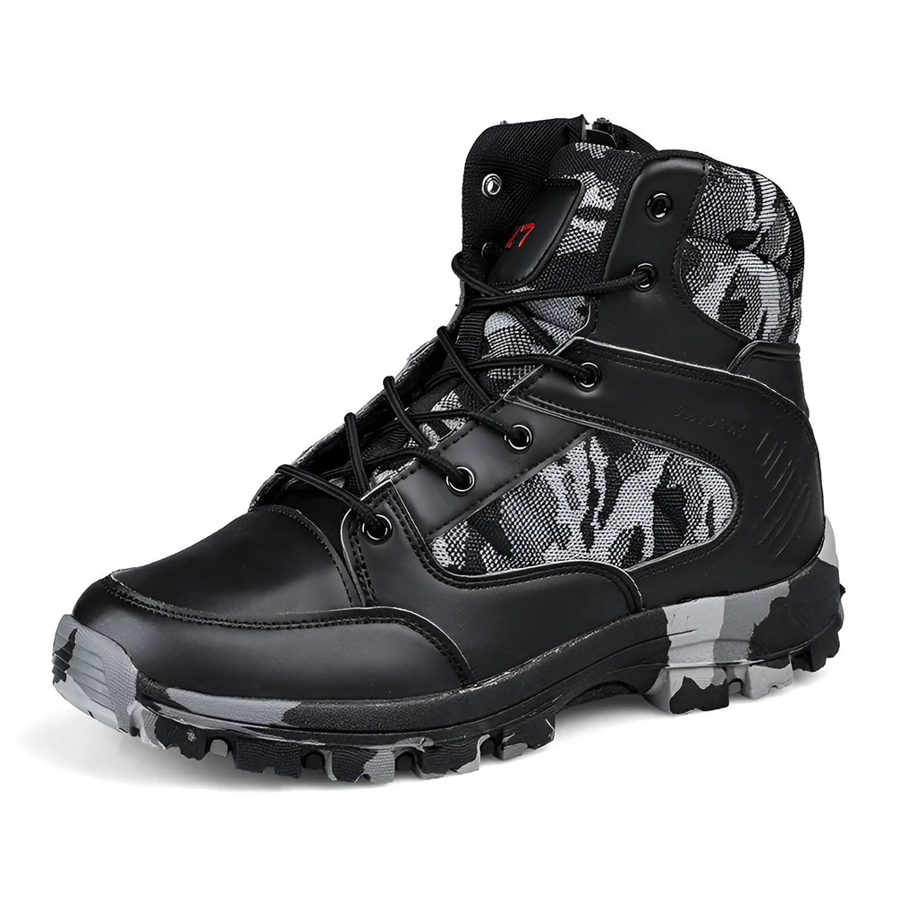 Men's black high-top hiking shoes with metal eyelets on a rocky outdoor path.