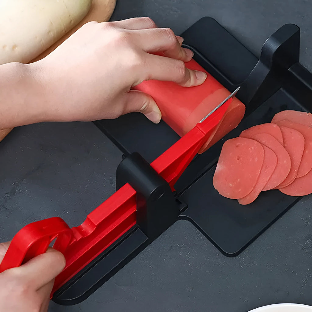 Green and red modern vegetable cutter with stainless steel blades for cutting carrots and potatoes.