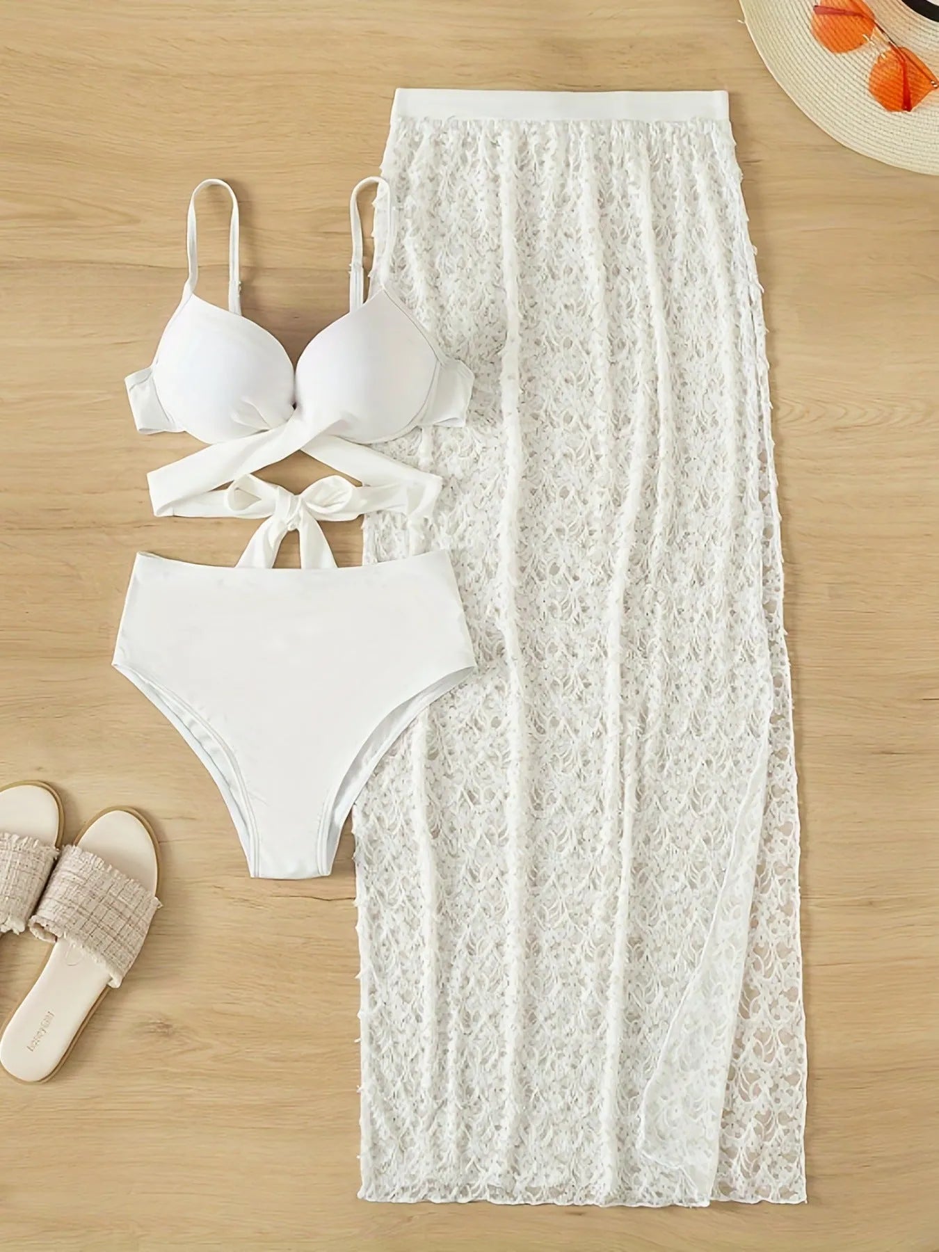 White three-piece swimsuit with long gathered skirt, sleeveless top, and briefs for swimming sports