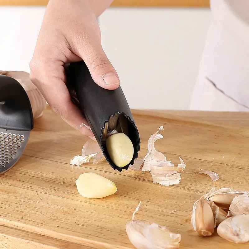 Stainless steel garlic press with polypropylene handles in modern design