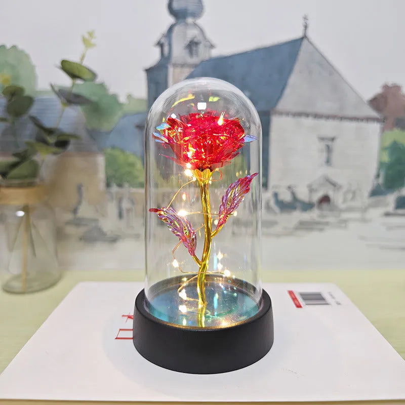 Glass cover small night lamp with plastic flowers in 15cm tall design with black base