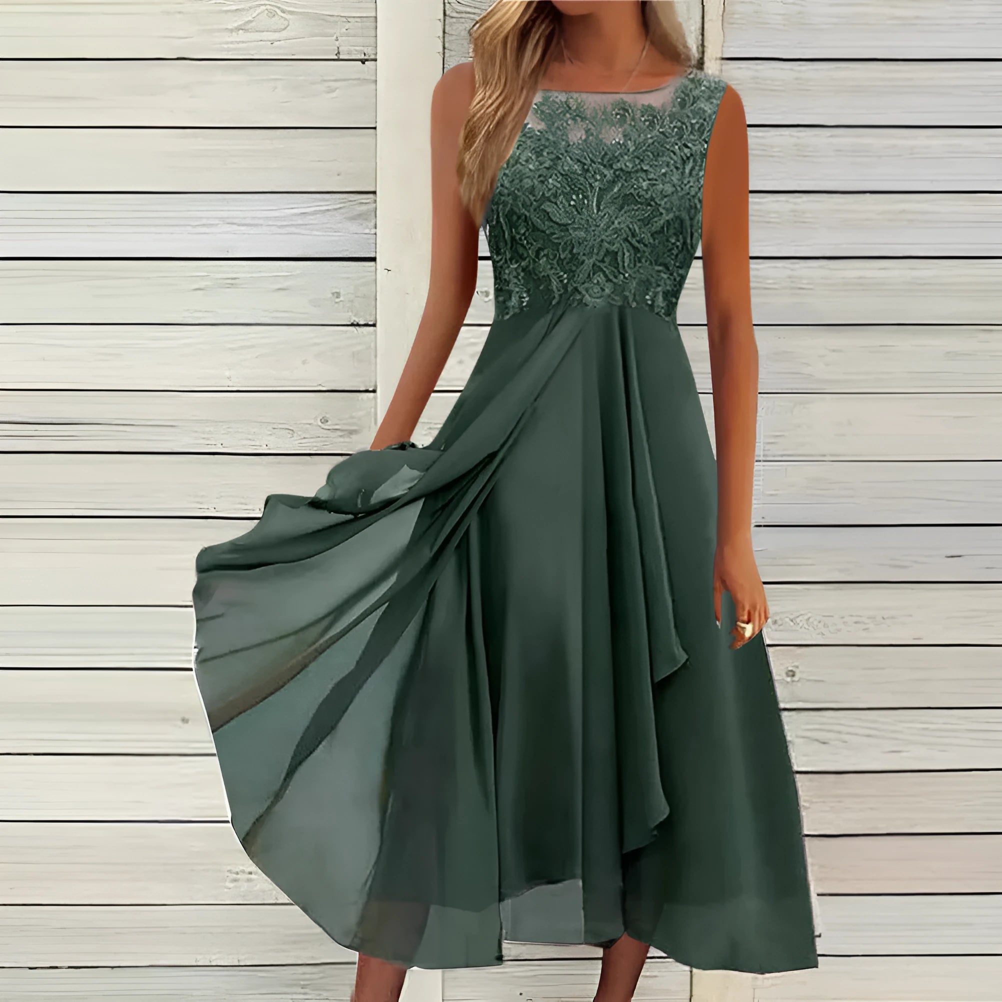 Women's sleeveless green chiffon dress with lace hollow-out detail and a mid-length princess skirt.