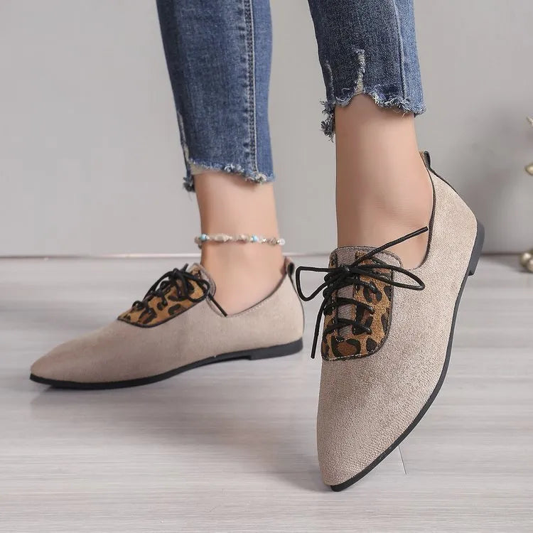 Beige leopard print women's pointed toe pumps with a rubber sole, shown in an extended size range.