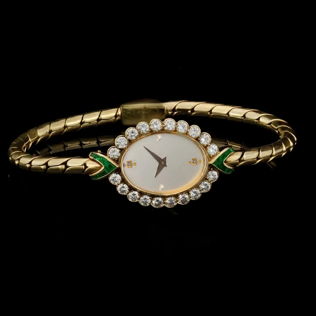 European small gold women's watch with handmade rhinestone inlay on a white background
