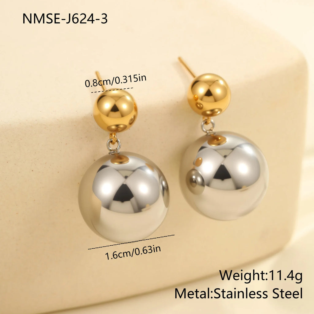 A pair of round bead geometric ear studs with a colour-block electroplated finish on stainless steel.