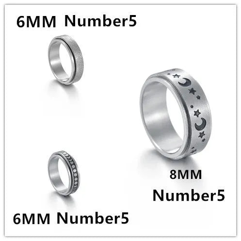 Titanium steel star moon ring in glossy finish on a neutral background, showing celestial motif and band width