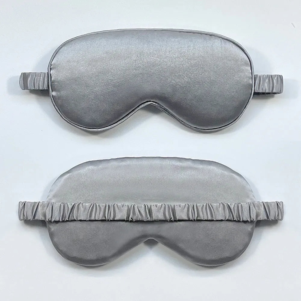 Rayon satin double-sided sleep mask in a selection of solid colours on a white background.
