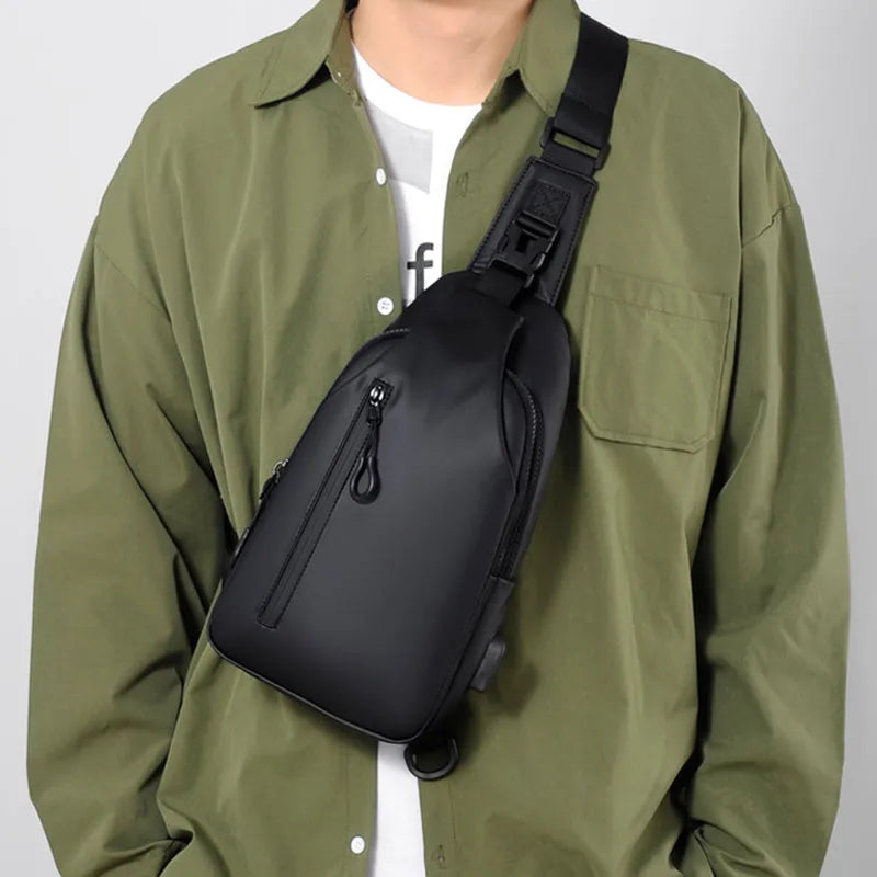 Black sling crossbody backpack for men with zipper and polyester lining, vertical square shape, solid colour design