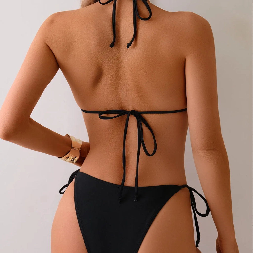 Black women's bikini swimsuit with silver metal bead detailing on the front.