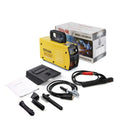 MMA-200MIN compact DC inverter welding machine with red housing, welding tongs, ground clamp, and face shield on a workbench.