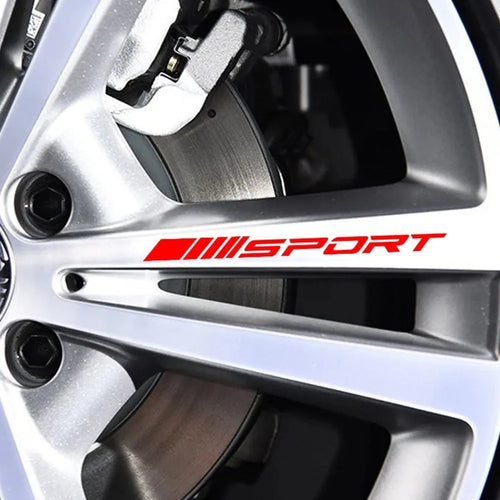 Hollow sport design car rim stickers in black, red, and white colours measuring 10x0.7cm