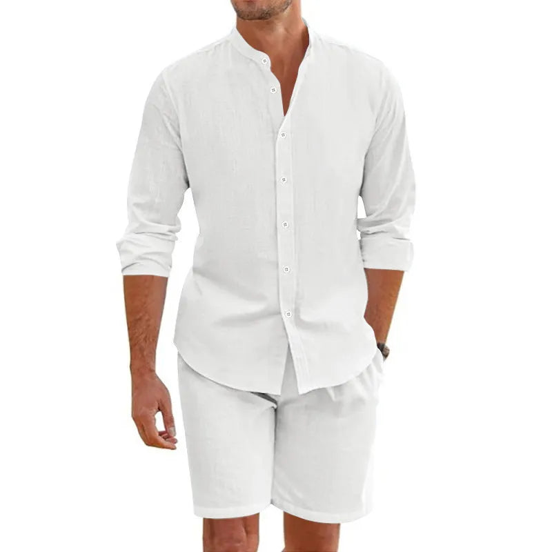 Men's dark grey linen-blend short sleeve button-down shirt and matching drawstring shorts on a beach