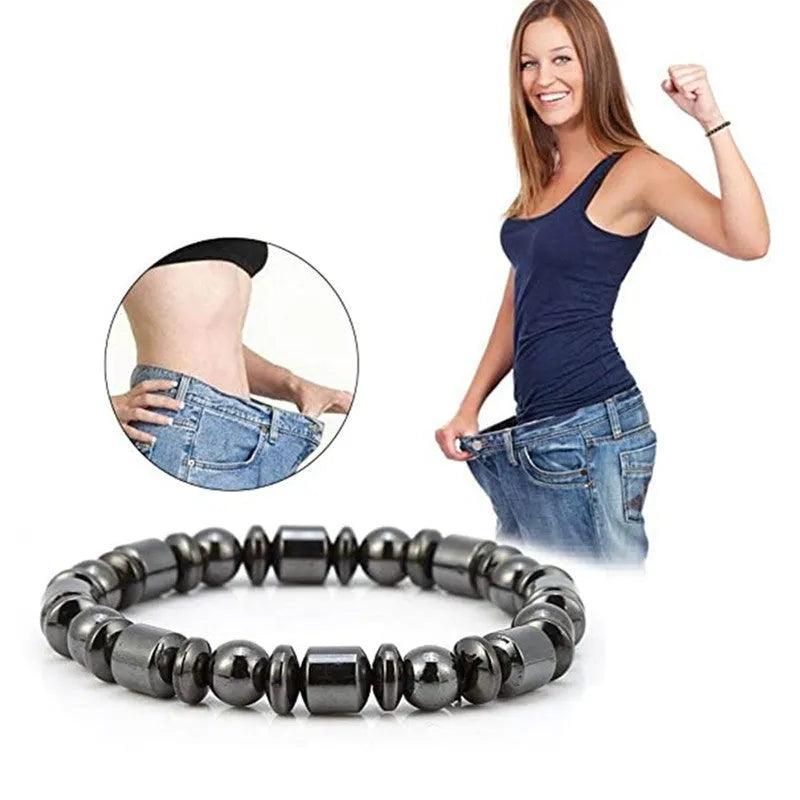 Black pentagram symbol magnetic bracelet with magnetite and hematite stones on a stretch band.
