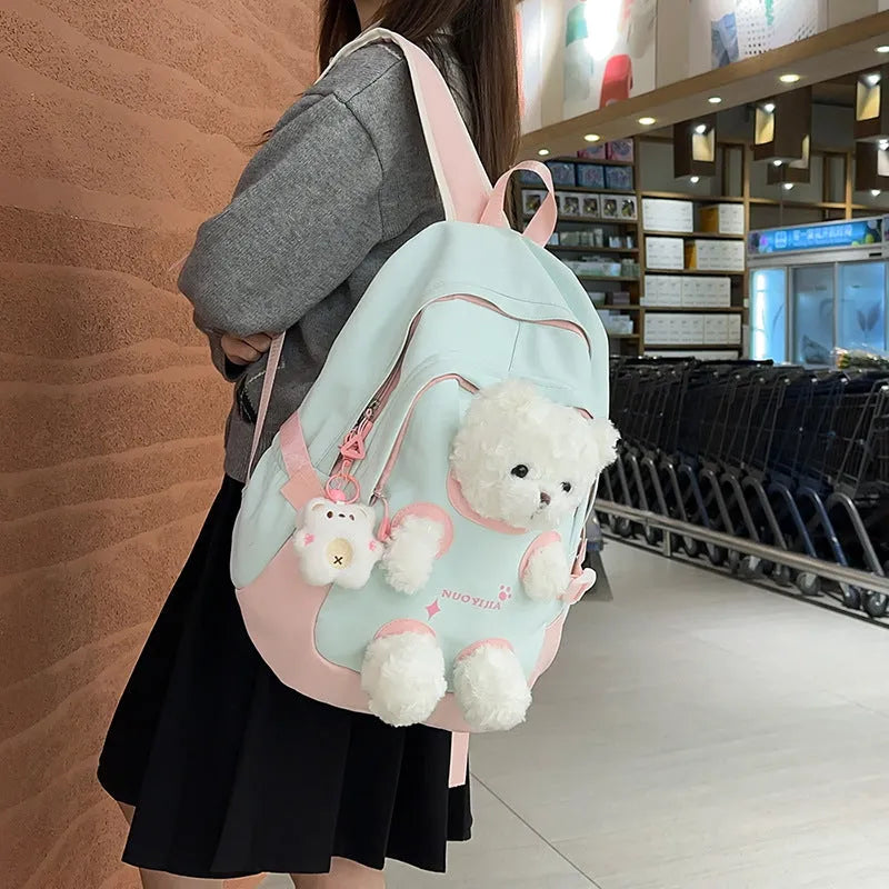 Nylon school backpack with curved shoulder straps in macaron colours including yellow pink