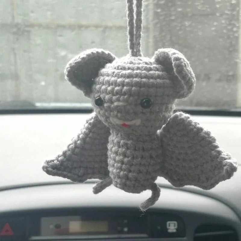 Plush hand-woven car hanging ornament in a cartoon design, made from soft polyester fabric.