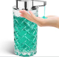 Silver automatic soap dispenser with USB Type-C charging port on a bathroom countertop.