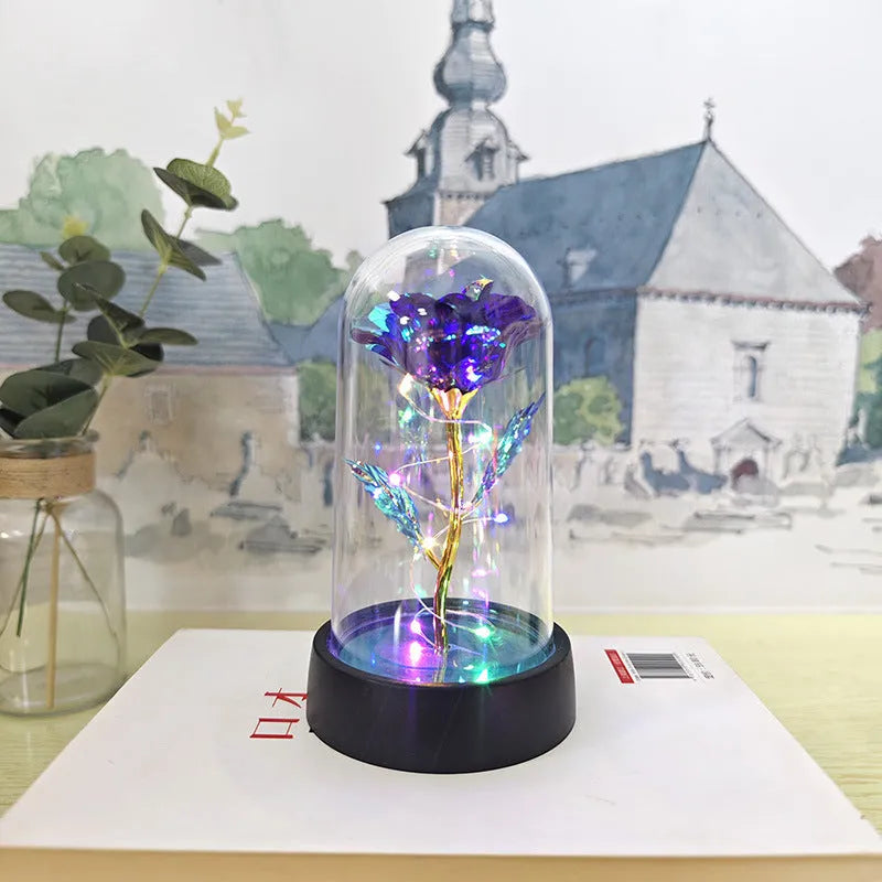 Glass cover small night lamp with plastic flowers in 15cm tall design with black base