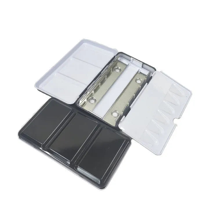 Square tinplate metal paint box for solid watercolours with folding compartment design.