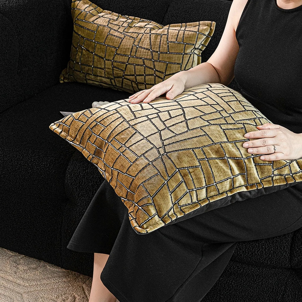 Tuhao gold geometric abstract pattern on square and lumbar cushion covers.